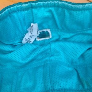 Diadora girls teal couple lined shorts.  With adjustable waist and